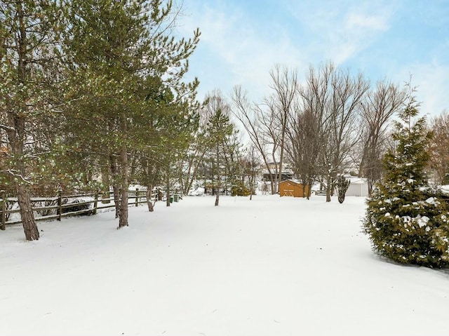 view of yard layered in snow