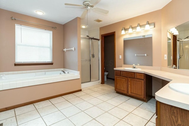 full bathroom with ceiling fan, plus walk in shower, tile patterned flooring, toilet, and vanity