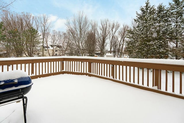 snow covered deck featuring area for grilling