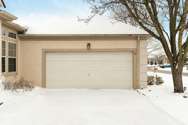 view of snow covered garage