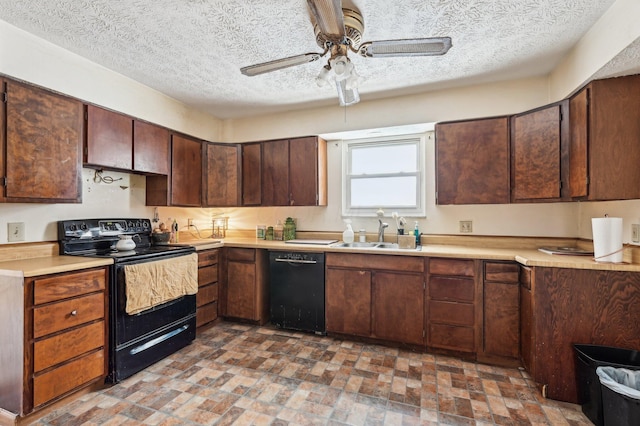 kitchen featuring ceiling fan, sink, a textured ceiling, dark brown cabinets, and black appliances