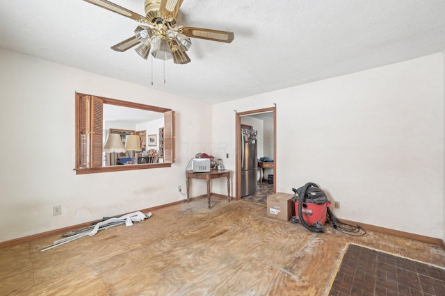 spare room with hardwood / wood-style floors and ceiling fan