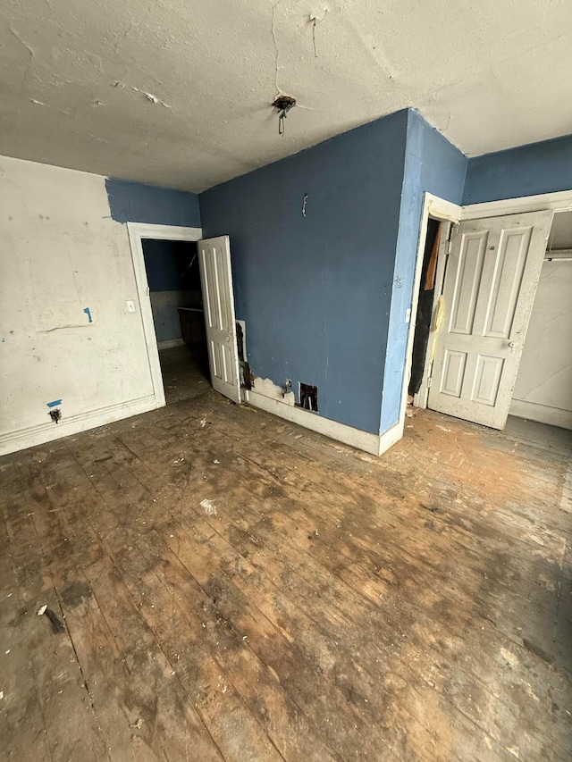 unfurnished bedroom featuring hardwood / wood-style floors