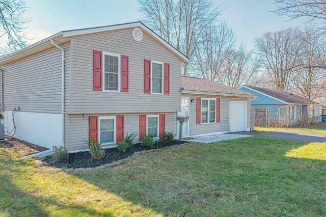 tri-level home with a front lawn