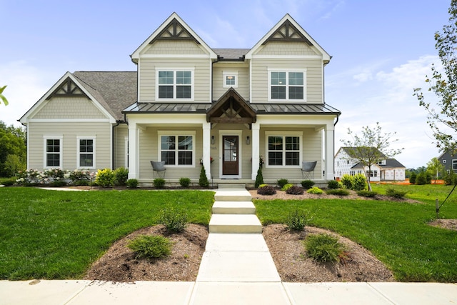 craftsman inspired home with a front lawn