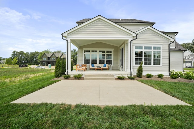 view of front of house with covered porch and a front yard