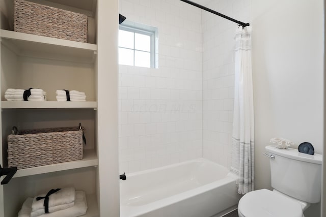 bathroom with shower / bath combo and toilet