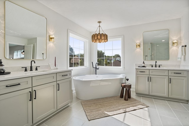 bathroom with tile patterned floors, vanity, and plus walk in shower