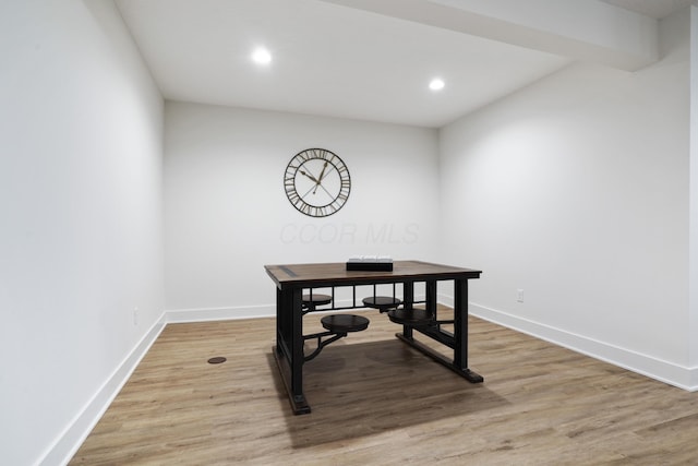 office area with vaulted ceiling with beams and hardwood / wood-style flooring