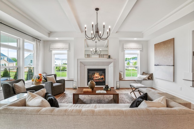 living room featuring wood-type flooring and a chandelier