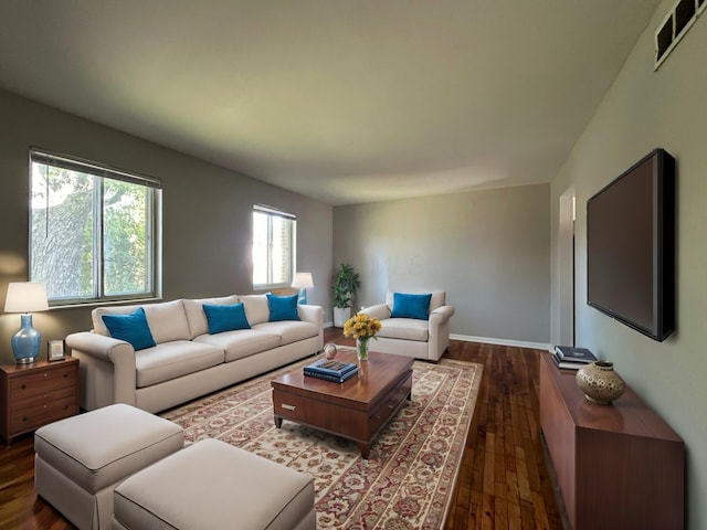 living room featuring dark hardwood / wood-style flooring and plenty of natural light