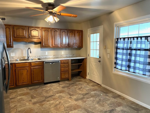 kitchen featuring ceiling fan, sink, and stainless steel appliances