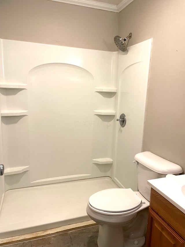 bathroom with vanity, a shower, tile patterned floors, toilet, and ornamental molding