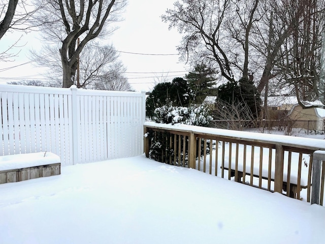 view of snow covered deck