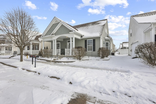 view of front of home with a porch and a garage