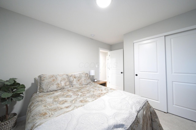 carpeted bedroom featuring a closet