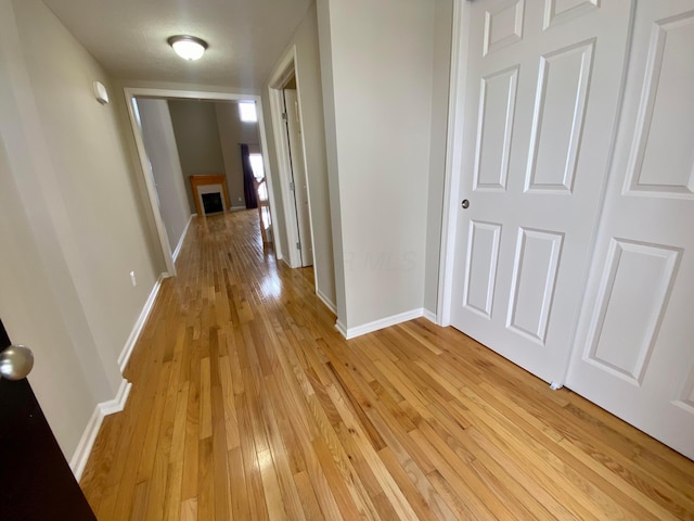 corridor featuring light wood-type flooring