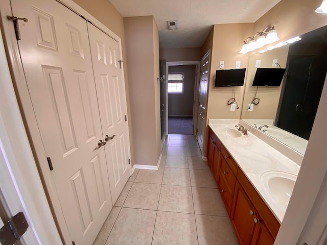 bathroom featuring tile patterned floors and vanity