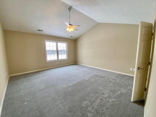 unfurnished room featuring carpet flooring, ceiling fan, and lofted ceiling