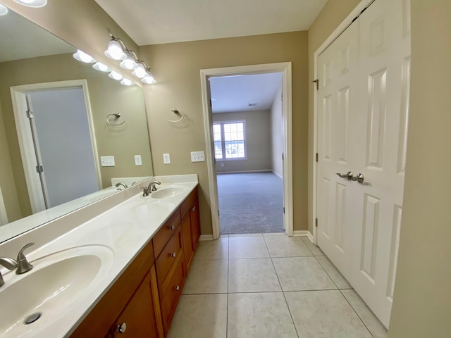 bathroom with tile patterned flooring and vanity