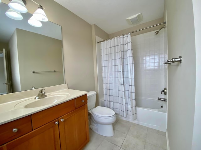 full bathroom with tile patterned floors, vanity, toilet, and shower / tub combo