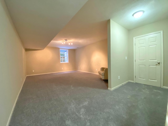 basement with dark carpet