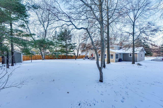 view of yard covered in snow