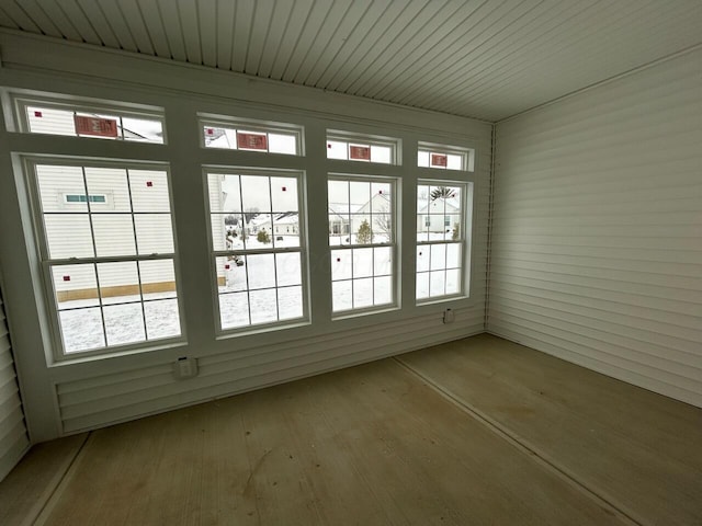 unfurnished sunroom with a wealth of natural light