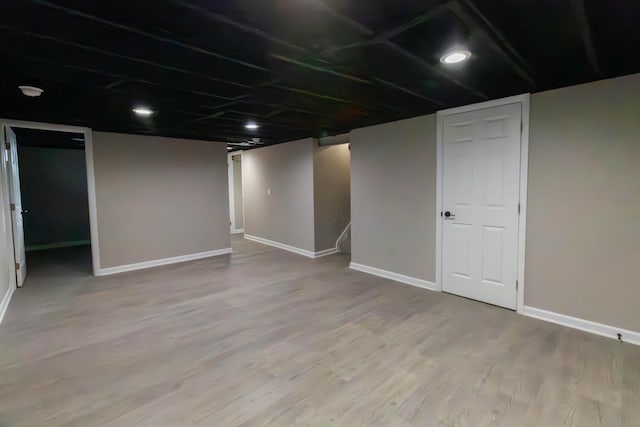 basement with wood-type flooring