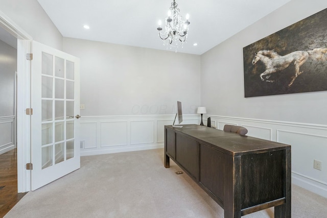 office space featuring an inviting chandelier and light colored carpet