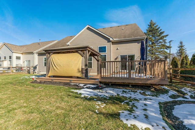 snow covered property with a lawn and a deck