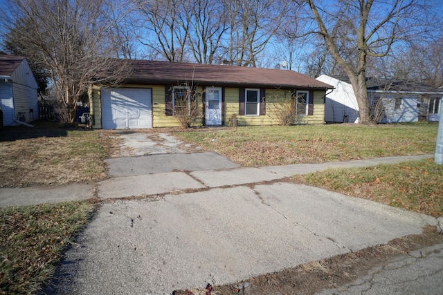 ranch-style home with a garage and a front lawn