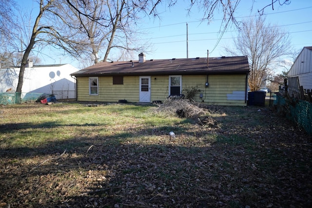 back of house with a yard