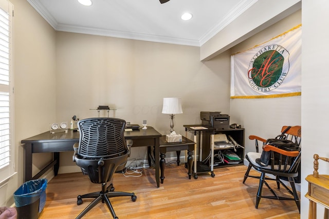 office area with hardwood / wood-style flooring, a healthy amount of sunlight, and ornamental molding