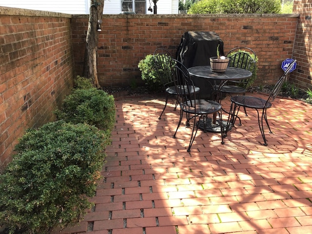 view of patio / terrace featuring outdoor dining area and grilling area