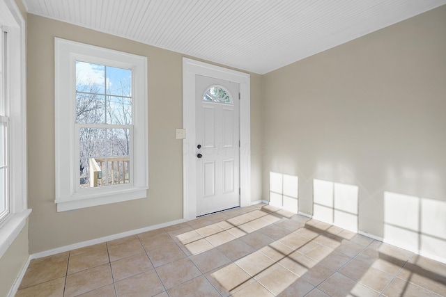 entryway with light tile patterned floors