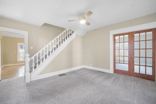 interior space with french doors, ceiling fan, and lofted ceiling