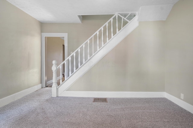 staircase with carpet