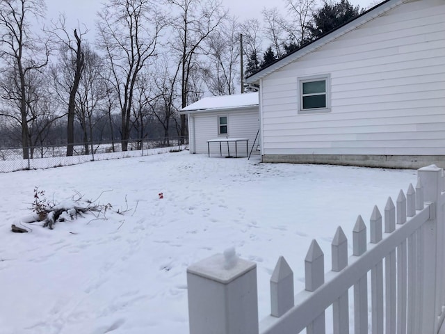 view of yard layered in snow