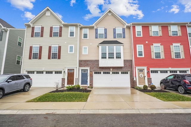 townhome / multi-family property featuring a garage