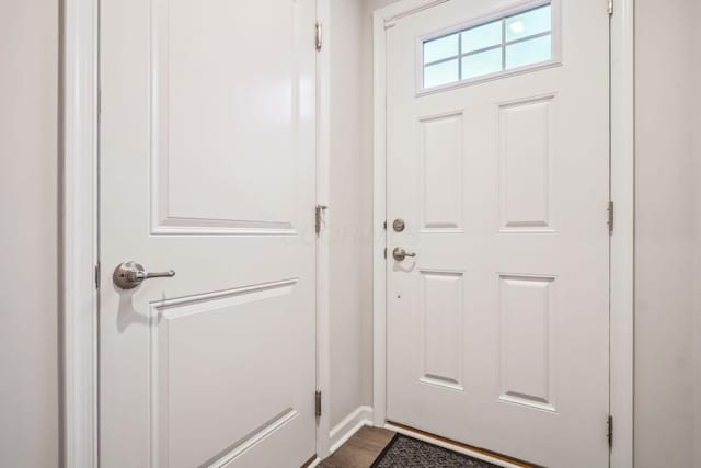 doorway with hardwood / wood-style floors