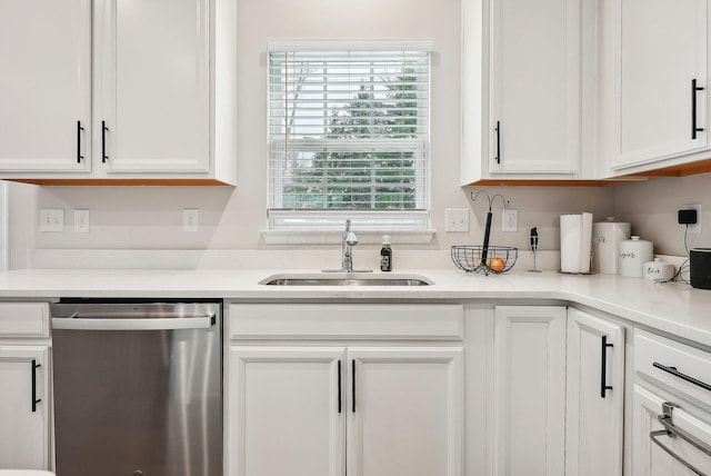 kitchen featuring dishwasher, white cabinetry, and sink