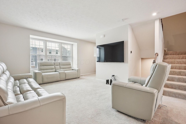 living room with light colored carpet and a textured ceiling