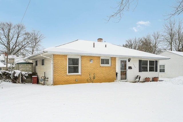 view of snow covered house