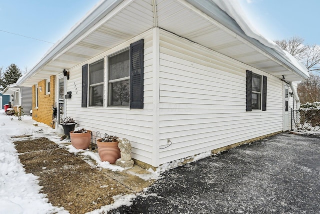 view of snow covered property