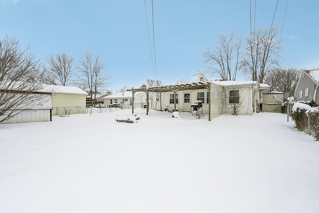 view of snow covered house