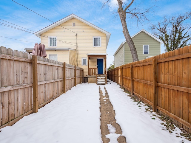 view of snow covered house