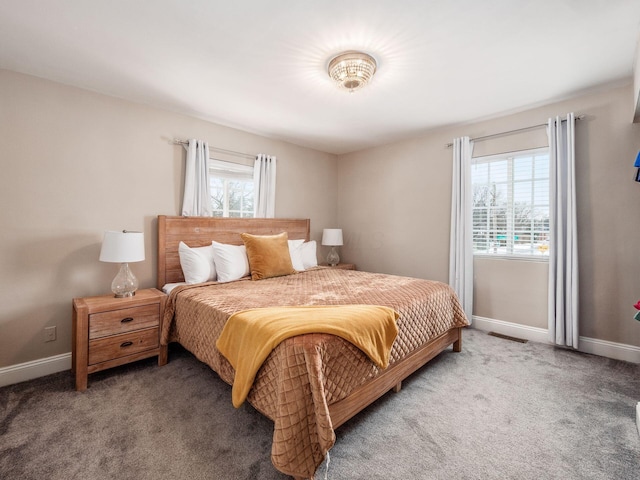 bedroom featuring dark carpet