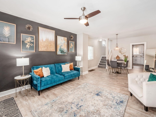 living room with ceiling fan and wood-type flooring