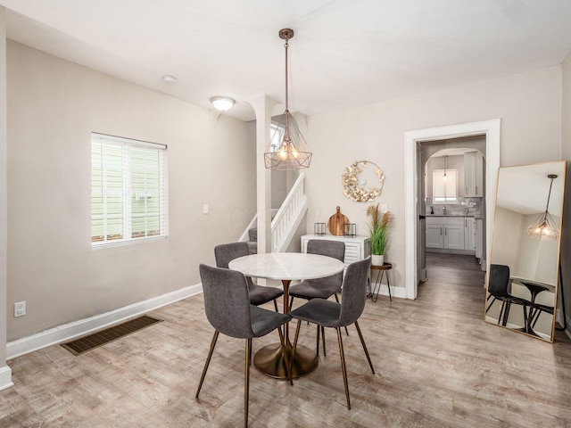 dining space featuring light hardwood / wood-style floors